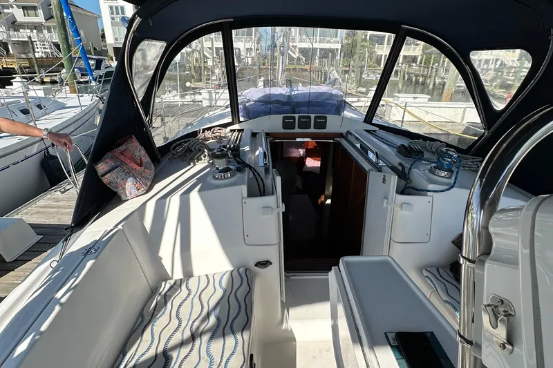 To The Gills Yacht Photos Pics Cockpit of 2014 Hunter 33 sailboat with seating and navigation equipment.