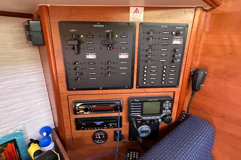 To The Gills Yacht Photos Pics Control panel of a 2014 Hunter 33 sailboat with navigation and communication equipment.