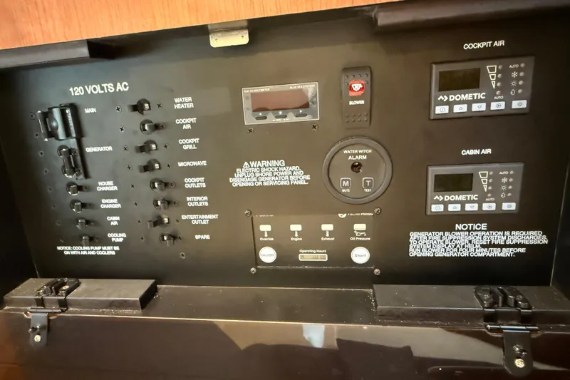  Yacht Photos Pics Control panel of 2025 Pursuit OS 325 Offshore boat, featuring various switches and displays.