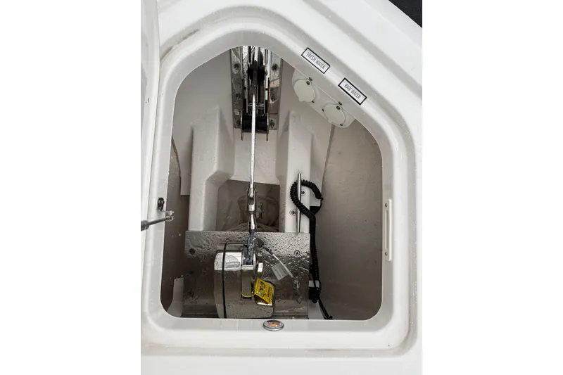  Yacht Photos Pics Anchor compartment of 2025 Pursuit OS 325 Offshore boat, featuring fresh and raw water access.