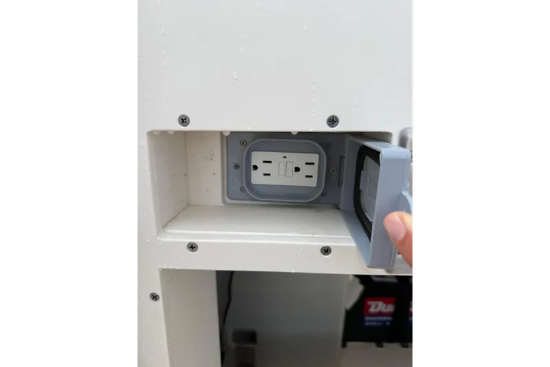  Yacht Photos Pics Electrical outlet with cover on 2025 Pursuit OS 325 Offshore boat.