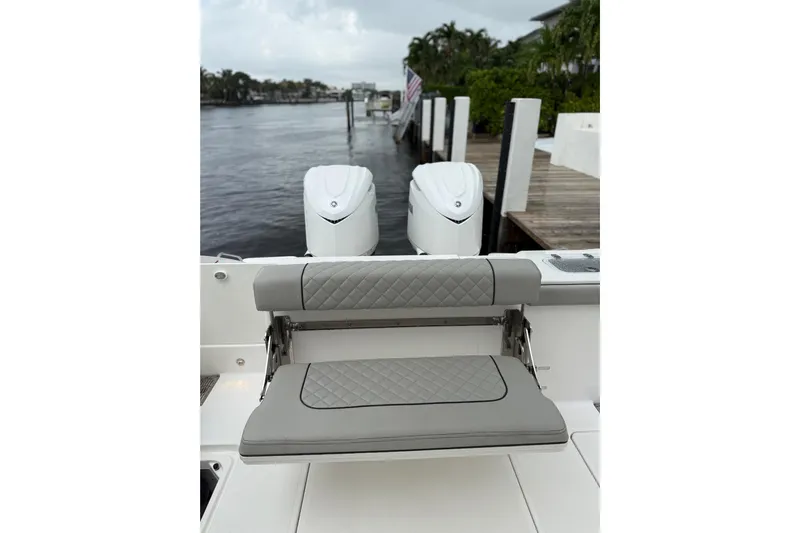  Yacht Photos Pics 2025 Pursuit OS 325 Offshore boat with dual engines and cushioned seating.