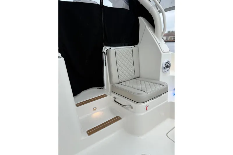  Yacht Photos Pics 2025 Pursuit OS 325 Offshore boat interior with cushioned seating and elegant design.