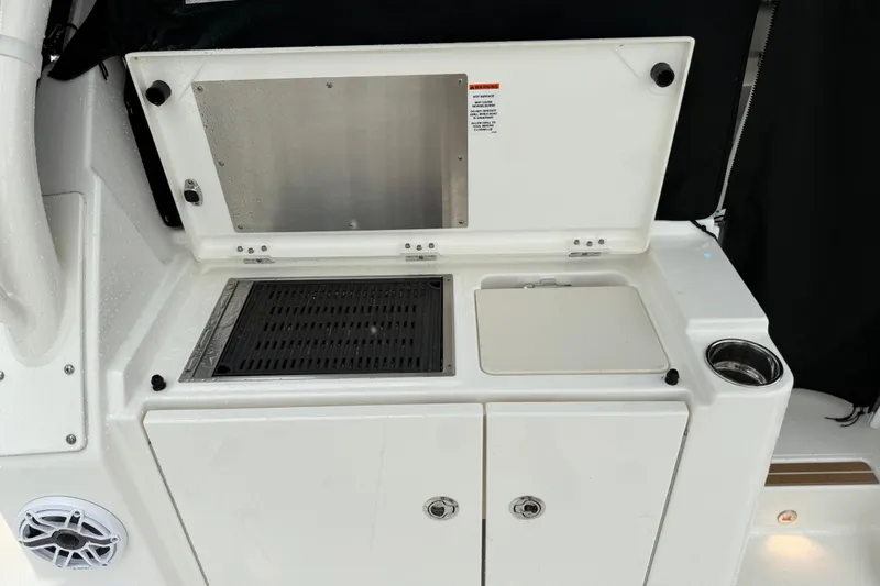  Yacht Photos Pics 2025 Pursuit OS 325 Offshore boat kitchen area with grill and storage.