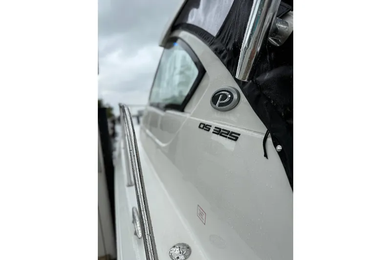  Yacht Photos Pics 2025 Pursuit OS 325 Offshore boat, close-up of logo and model name.