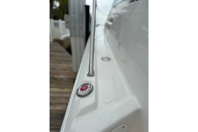  Yacht Photos Pics 2025 Pursuit OS 325 Offshore boat deck with sleek design and metallic accents.