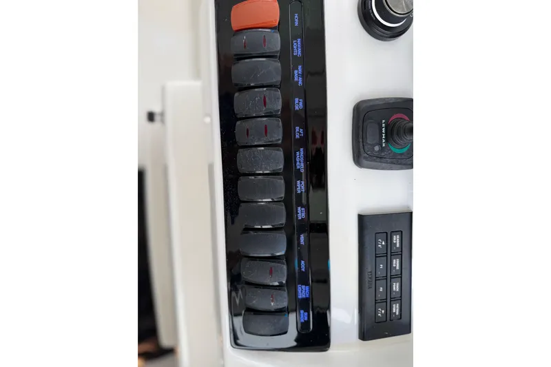  Yacht Photos Pics Control panel of 2025 Pursuit OS 325 Offshore boat with switches and joystick.