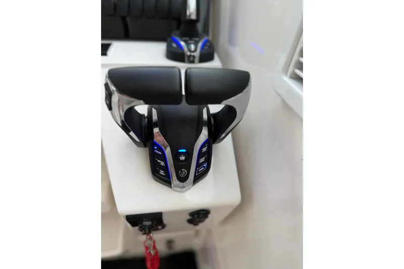  Yacht Photos Pics Control panel of 2025 Pursuit OS 325 Offshore boat with illuminated buttons.