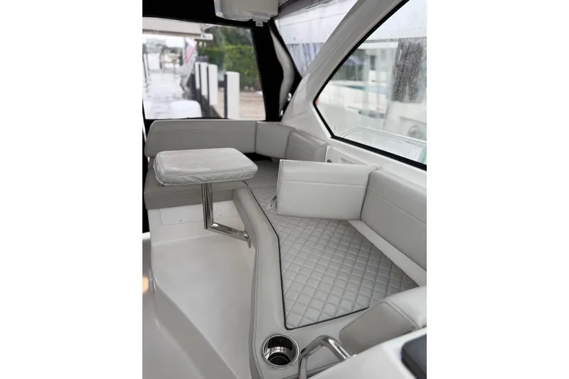  Yacht Photos Pics 2025 Pursuit OS 325 Offshore boat interior with sleek seating and modern design.