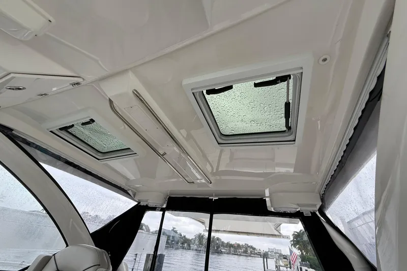  Yacht Photos Pics Interior view of 2025 Pursuit OS 325 Offshore boat with rain-covered skylights.