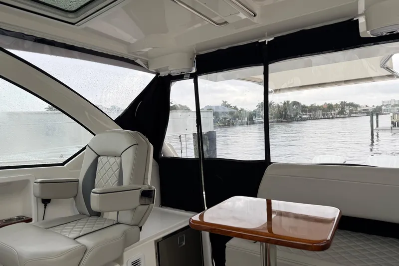  Yacht Photos Pics Interior of 2025 Pursuit OS 325 Offshore boat with luxurious seating and waterfront view.