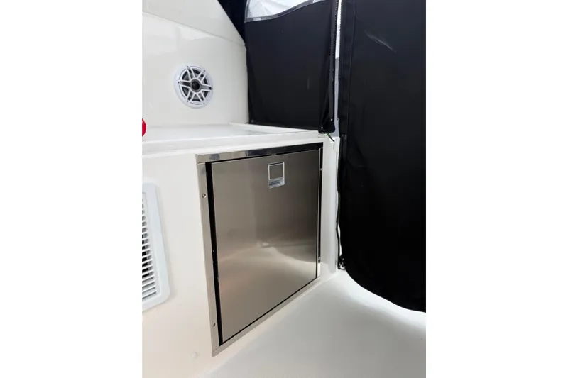  Yacht Photos Pics 2025 Pursuit OS 325 Offshore boat interior with stainless steel storage compartment.