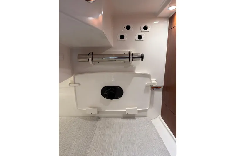  Yacht Photos Pics Interior view of 2025 Pursuit OS 325 Offshore boat, featuring storage and fixtures.