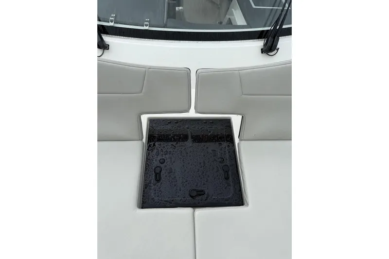  Yacht Photos Pics 2025 Pursuit OS 325 Offshore boat seating with wet black hatch cover.