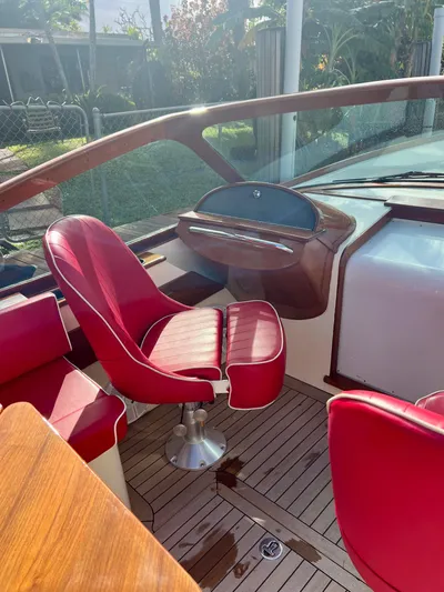 Le Ti Yacht Photos Pics 2004 Hinckley Talaria 29R boat interior with red leather seats and wooden accents.