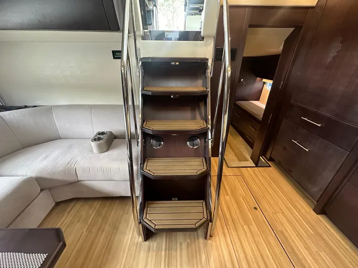  Yacht Photos Pics Interior of 2017 Regal 53 Sport Coupe with wooden stairs and modern furnishings.