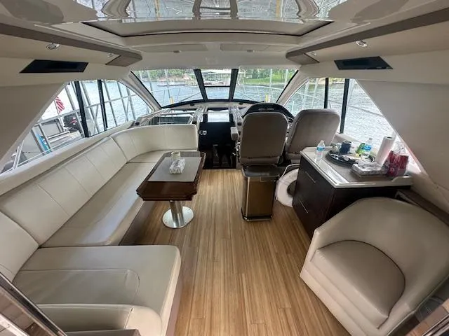  Yacht Photos Pics Luxurious interior of 2017 Regal 53 Sport Coupe yacht with elegant seating and helm.