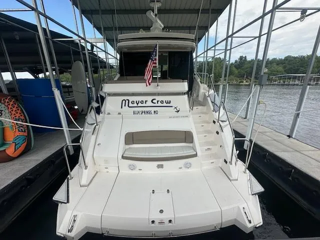  Yacht Photos Pics 2017 Regal 53 Sport Coupe docked, rear view with American flag and "Meyer Crew" signage.