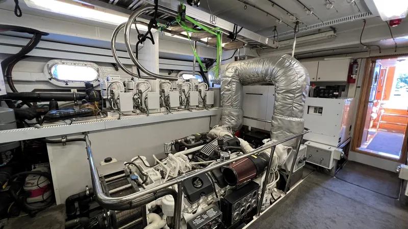 Missy B II Yacht Photos Pics Engine room of a 2005 Hargrave Custom Yacht, showcasing machinery and equipment.