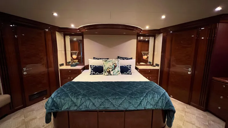 Missy B II Yacht Photos Pics Luxurious bedroom interior of 2005 Hargrave Custom Yacht with elegant wood finishes and plush bedding.