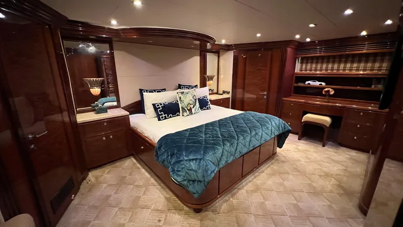 Missy B II Yacht Photos Pics Luxurious bedroom interior of a 2005 Hargrave Custom Yacht with elegant wood finishes.