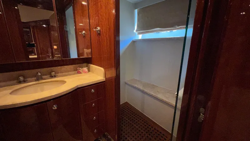 Missy B II Yacht Photos Pics Luxurious bathroom in 2005 Hargrave Custom Yacht with wooden cabinetry and modern fixtures.