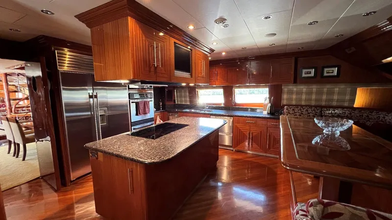 Missy B II Yacht Photos Pics Luxurious 2005 Hargrave Custom Yacht kitchen with wood cabinetry and modern appliances.