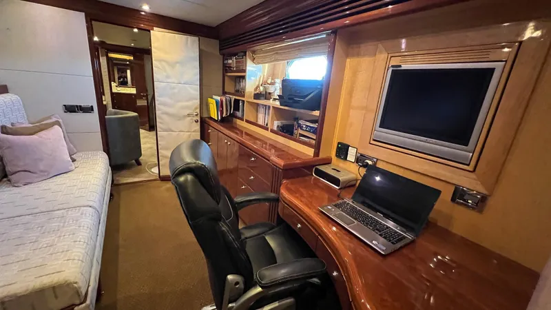 Missy B II Yacht Photos Pics Luxurious 2005 Hargrave Custom Yacht interior with office space, desk, and bed.