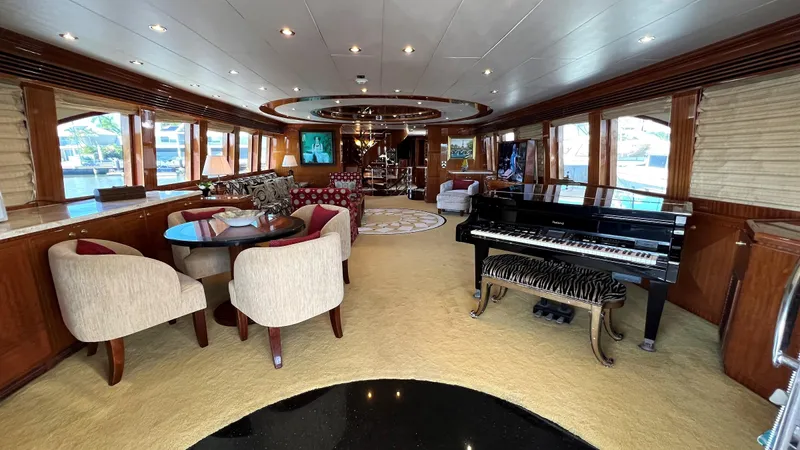Missy B II Yacht Photos Pics Luxurious interior of a 2005 Hargrave Custom Yacht featuring elegant seating and a grand piano.