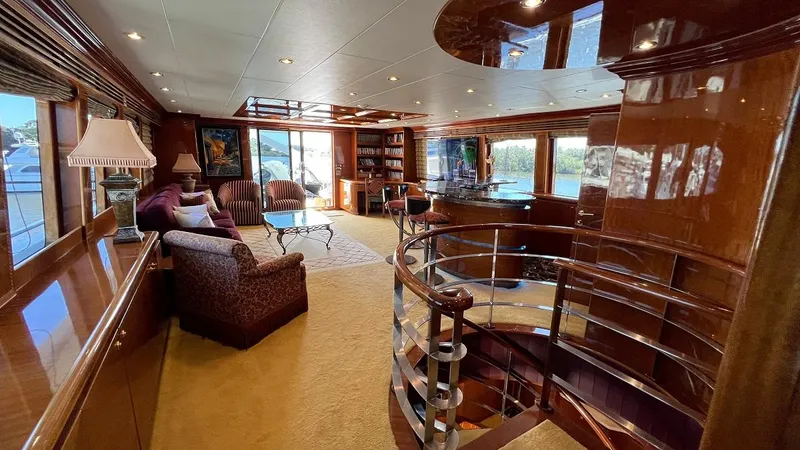Missy B II Yacht Photos Pics Luxurious interior of a 2005 Hargrave Custom Yacht with elegant furnishings and spiral staircase.