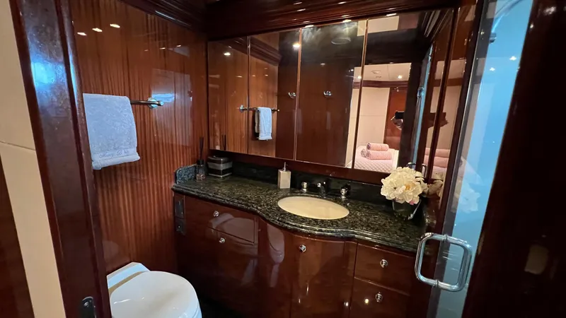 Missy B II Yacht Photos Pics Luxurious bathroom in a 2005 Hargrave Custom Yacht with elegant wood finishes and granite countertop.