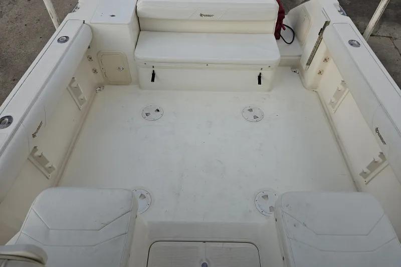 2001 Pursuit 2870 Walkaround boat interior, featuring spacious seating and storage areas.