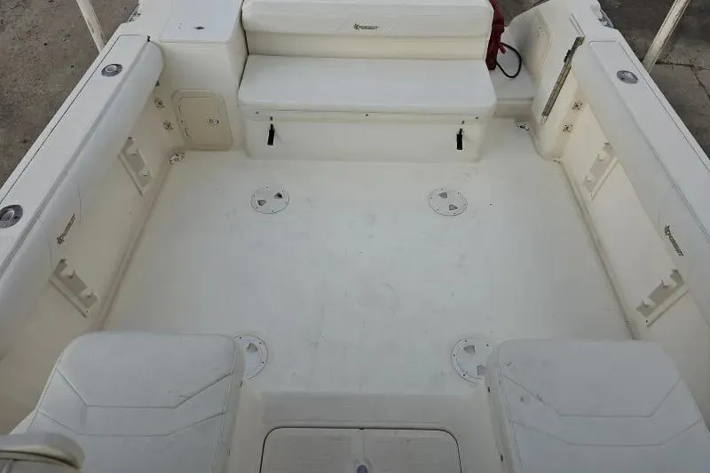 2001 Pursuit 2870 Walkaround boat interior, featuring spacious seating and storage areas.
