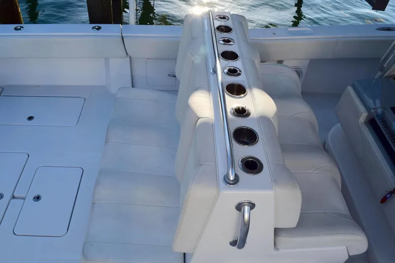 Caryali Yacht Photos Pics 2014 Invincible Open Fisherman boat seating with multiple cup holders.