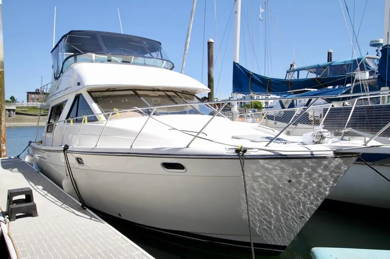  Yacht Photos Pics 2002 Bayliner 3988 yacht docked at marina, sunny day, sleek design.