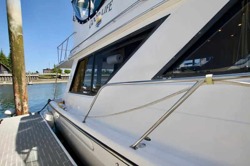  Yacht Photos Pics 2002 Bayliner 3988 yacht docked at marina, showcasing sleek design and waterfront setting.