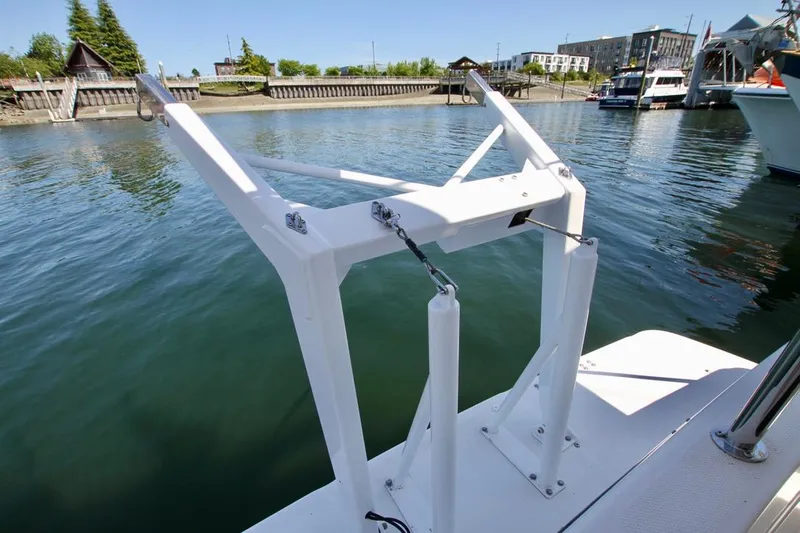  Yacht Photos Pics 2002 Bayliner 3988 boat deck with white metal structure by the water.