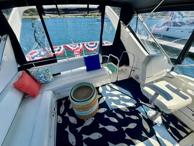  Yacht Photos Pics 2002 Bayliner 3988 yacht interior with seating, nautical decor, and water view.