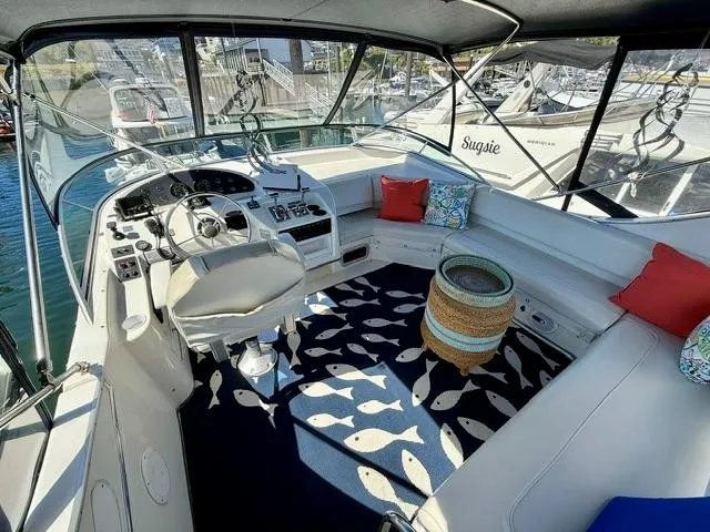  Yacht Photos Pics 2002 Bayliner 3988 boat interior with helm, seating, and nautical-themed decor.