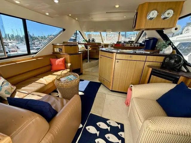  Yacht Photos Pics Luxurious interior of a 2002 Bayliner 3988 yacht with comfortable seating and elegant decor.