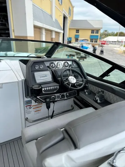  Yacht Photos Pics 2015 Cruisers Sport Series 328 boat cockpit with modern controls and steering wheel.
