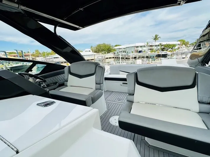 Yacht Photos Pics 2015 Cruisers Sport Series 328 boat interior with modern seating and marina view.