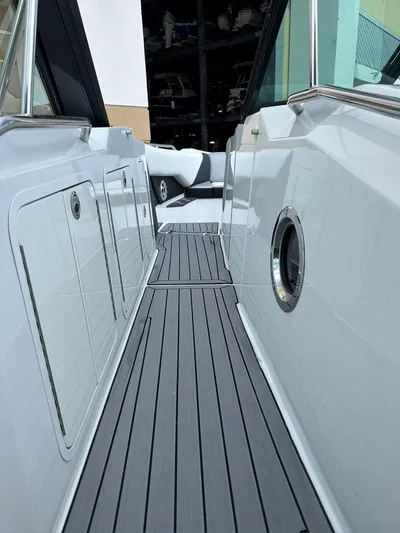  Yacht Photos Pics 2015 Cruisers Sport Series 328 boat deck with sleek design and modern features.