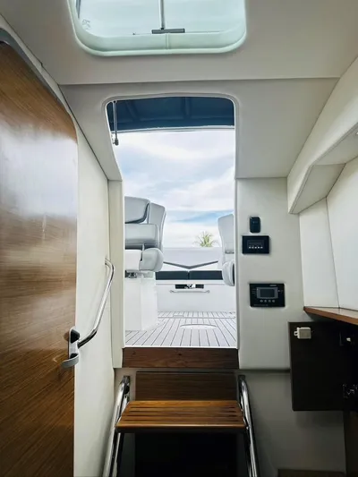  Yacht Photos Pics Interior view of 2015 Cruisers Sport Series 328 yacht, showing stairs to deck.