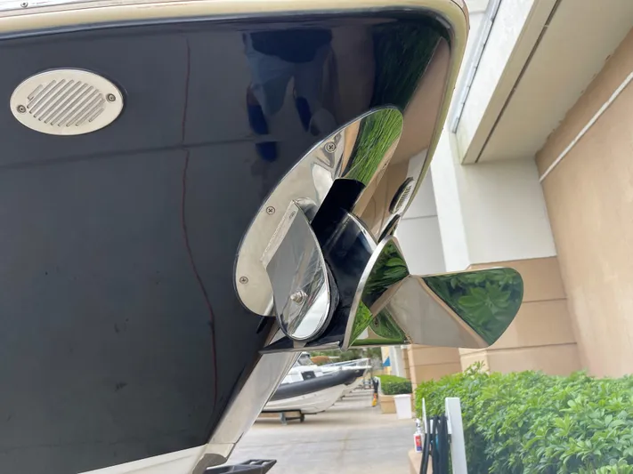  Yacht Photos Pics Close-up of 2015 Cruisers Sport Series 328 boat propeller and stern.
