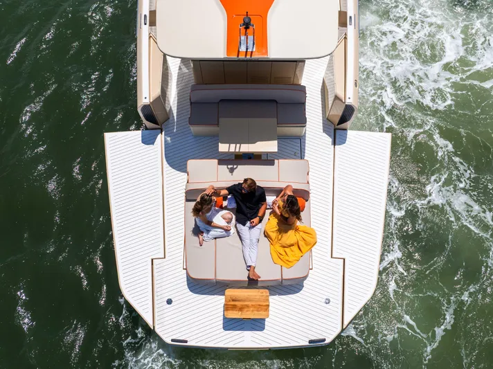  Yacht Photos Pics Aerial view of people relaxing on a 2026 Bellini Astor 36 yacht deck.
