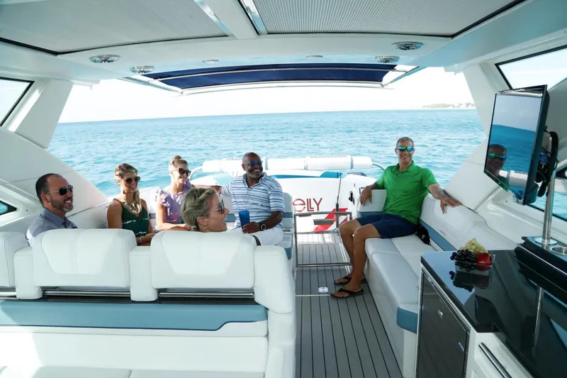 Endless Summer Yacht Photos Pics Manufacturer Provided Image: 2023 Formula 430 Super Sport Crossover yacht with people relaxing on deck.
