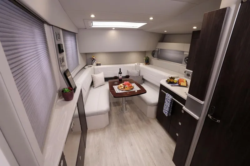 Endless Summer Yacht Photos Pics Manufacturer Provided Image: 2023 Formula 430 Super Sport Crossover interior with dining area and kitchenette.