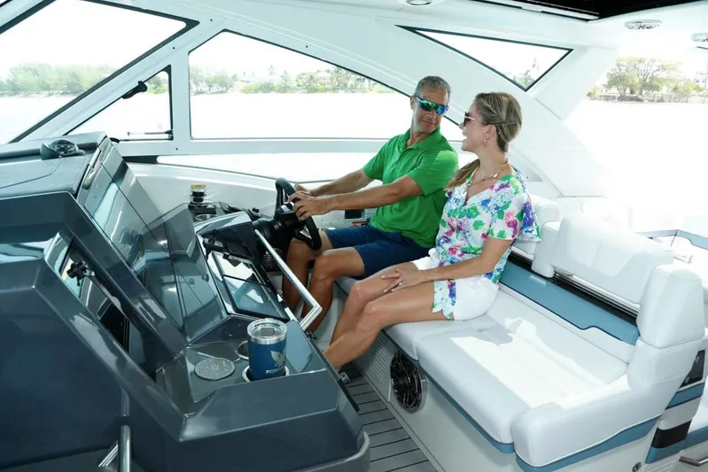 Endless Summer Yacht Photos Pics Manufacturer Provided Image: 2023 Formula 430 Super Sport Crossover interior with two people enjoying the ride.