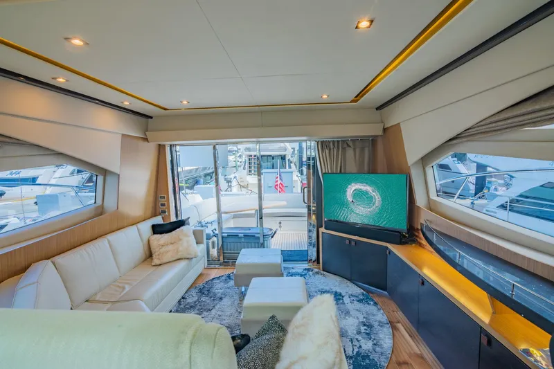 The Empire Yacht Photos Pics Luxurious interior of 2018 Sea Ray L590 yacht with modern furnishings and large windows.